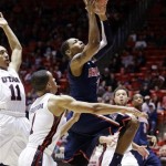 Arizona's Mark Lyons (2) goes to the basket as Utah's Glen Dean (1) defends in the first half of an NCAA college basketball game, Sunday, Feb. 17, 2013, in Salt Lake City. (AP Photo/Rick Bowmer)