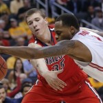 Ohio State's Deshaun Thomas, right, reaches for the ball in front of Arizona's Kaleb Tarczewski during the second half of a West Regional semifinal in the NCAA men's college basketball tournament, Thursday, March 28, 2013, in Los Angeles. (AP Photo/Jae C. Hong)