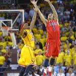 Arizona guard Gabe York, right, catches a pass as Southern California guard Pe'Shon Howard defends during the first half of an NCAA college basketball game, Sunday, Jan. 12, 2014, in Los Angeles. (AP Photo/Mark J. Terrill)