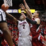 Arizona's Mark Lyons (2) shoots over Stanford's Dwight Powell (33) during the second half of an NCAA college basketball game at McKale Center in Tucson, Ariz., Wednesday, Feb. 6, 2013. Arizona won 73-66. (AP Photo/Wily Low)