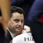 Arizona head coach Sean Miller looks at his players during a timeout in the first half of an NCAA college basketball game against Washington at McKale Center in Tucson, Ariz., Wednesday, Feb. 20, 2013. (AP Photo/Wily Low)