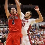 Arizona's T.J. McConnell (4) shoots next to Stanford guard Robbie Lemons during the first half of an NCAA college basketball game on Wednesday, Jan. 29, 2014, in Stanford, Calif. (AP Photo/Marcio Jose Sanchez)