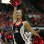  Arizona's Pom Line girl, Melissa Bermudez gets the crowd cheering during a timeout against Washington State in the second half of an NCAA college basketball game on Thursday, Jan. 2, 2014 in Tucson, Ariz. Arizona won 60 - 25. (AP Photo/John MIller)
