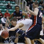 Arizona's Kaleb Tarczewski, center, grabs the ball as Belmont's Blake Jenkins, left, and Trevor Noack look on during the first half of a second-round game in the NCAA college basketball tournament in Salt Lake City Thursday, March 21, 2013. (AP Photo/George Frey)