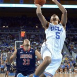 UCLA guard Kyle Anderson, right, puts up a shot in front of Arizona forward Grant Jerrett during the first half of an NCAA college basketball game, Saturday, March 2, 2013, in Los Angeles. (AP Photo/Mark J. Terrill)