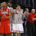 Ohio State players react from the bench to a blocked shot during the first half of a West Regional semifinal against Arizona in the NCAA men's college basketball tournament, Thursday, March 28, 2013, in Los Angeles. Arizona's Mark Lyons is at left. (AP Photo/Jae C. Hong)