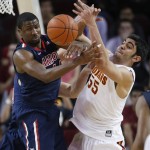 Arizona's Solomon Hill, left, and Southern California's Omar Oraby vie for a rebound during the second half of an NCAA college basketball game in Los Angeles, Wednesday, Feb. 27, 2013. USC won 89-78. (AP Photo/Jae C. Hong)