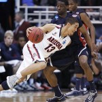 Belmont's Ian Clark defends Arizona's Nick Johnson on a drive to the basket in the second half of a second-round game in the NCAA men's college basketball tournament in Salt Lake City Thursday, March 21, 2013. Arizona defeated Belmont 81-64. (AP Photo/George Frey)