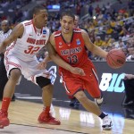Arizona's Nick Johnson, right, tries to drive around Ohio State's Lenzelle Smith Jr. during the first half of a West Regional semifinal in the NCAA men's college basketball tournament, Thursday, March 28, 2013, in Los Angeles. (AP Photo/Mark J. Terrill)