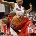 Arizona's Rondae Hollis-Jefferson, front, is defended by Stanford forward Josh Huestis during the first half of an NCAA college basketball game on Wednesday, Jan. 29, 2014, in Stanford, Calif. (AP Photo/Marcio Jose Sanchez)