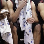 Harvard's Christian Webster buries his face in a towel at the end of Harvard's third-round game against Arizona in the NCAA men's college basketball tournament in Salt Lake City on Saturday, March 23, 2013. Arizona won 74-51. (AP Photo/Rick Bowmer)
