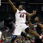 Arizona forward Solomon Hill (44) shoots a layup ahead of San Diego State guard Chase Tapley (22) in the first half of an NCAA college basketball game at the Diamond Head Classic, Tuesday, Dec. 25, 2012, in Honolulu. (AP Photo/Eugene Tanner)