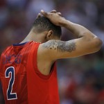 Arizona's Mark Lyons hangs his head after Arizona's 73-70 to Ohio State in their West Regional semifinal in the NCAA men's college basketball tournament, Thursday, March 28, 2013, in Los Angeles. (AP Photo/Jae C. Hong)