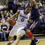 Washington's Abdul Gaddy (0) drives around Arizona's Nick Johnson, right, in the first half of an NCAA college basketball game, Thursday, Jan. 31, 2013, in Seattle. (AP Photo/Ted S. Warren)