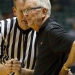 An official talks with San Diego State head coach Steve Fisher, right, in the first half of an NCAA college basketball game against Arizona at the Diamond Head Classic, Tuesday, Dec. 25, 2012, in Honolulu. (AP Photo/Eugene Tanner)