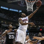 Arizona's Mark Lyons shoots in front of Harvard's Wesley Saunders during the second half of a third-round game in the NCAA men's college basketball tournament in Salt Lake City on Saturday, March 23, 2013. Arizona Beat Harvard 74-51. (AP Photo/George Frey)
