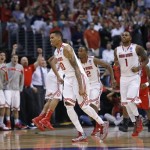 Ohio State's LaQuinton Ross, left, Sam Thompson, center, and Deshaun Thomas celebrate the team's 73-70 win over Arizona in a West Regional semifinal in the NCAA men's college basketball tournament, Thursday, March 28, 2013, in Los Angeles. (AP Photo/Mark J. Terrill)