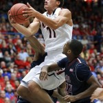Arizona's Aaron Gordon (11) goes between the defense of Fairleigh Dickinson for two in the first half of an college NCAA basketball game, Monday, Nov. 18, 2013 in Tucson, Ariz. (AP Photo/John Miller)