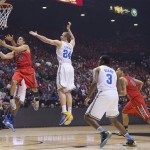 Arizona's Nick Johnson (13) drives in for a layup against UCLA in the first half during a semifinal Pac-12 tournament NCAA college basketball game, Friday, March 15, 2013, in Las Vegas. (AP Photo/Julie Jacobson)