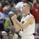Arizona guard T.J. McConnell (4) pumps his fists during the second half in a regional semifinal NCAA college basketball tournament game against San Diego State, Thursday, March 27, 2014, in Anaheim, Calif. (AP Photo/Jae C. Hong)
