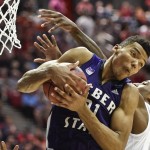 Weber State's Joel Bolomboy pulls a rebound away from Arizona forward Rondae Hollis-Jefferson during the second half in a second-round game in the NCAA college basketball tournament Friday, March 21, 2014, in San Diego. (AP Photo/Denis Poroy)