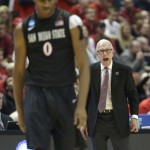 San Diego State head coach Steve Fisher yells to San Diego State forward Skylar Spencer (0) during the second half in a regional semifinal NCAA college basketball tournament game against Arizona, Thursday, March 27, 2014, in Anaheim, Calif. (AP Photo/Jae C. Hong)