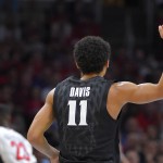 Xavier guard Dee Davis reacts after making a three-point shot during the second half of a college basketball regional semifinal against Arizona in the NCAA Tournament, Thursday, March 26, 2015, in Los Angeles. (AP Photo/Mark J. Terrill)