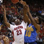 Arizona's Rondae Hollis-Jefferson, left, vies for a rebound with UCLA's Isaac Hamilton during the second half of an NCAA college basketball game in the semifinals of the Pac-12 conference tournament Friday, March 13, 2015, in Las Vegas. Arizona defeated UCLA 70-64. (AP Photo/John Locher)