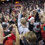 UNLV fans storm the court after UNLV defeated Arizona 71 - 67 in an NCAA college basketball game Tuesday, Dec. 23, 2014, in Las Vegas. (AP Photo/Eric Jamison)
