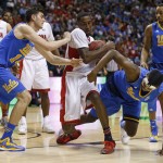 Arizona's Rondae Hollis-Jefferson, center, battles for the ball with UCLA's Gyorgy Goloman, left, and Kevon Looney, right, during the second half of an NCAA college basketball game in the semifinals of the Pac-12 conference tournament Friday, March 13, 2015, in Las Vegas. Arizona defeated UCLA 70-64. (AP Photo/John Locher)