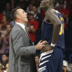 UC Irvine head coach Russell Turner, left, talks to UC Irvine center Mamadou Ndiaye (34) in the second half during an NCAA college basketball game against Arizona, Wednesday, Nov. 19, 2014, in Tucson, Ariz. (AP Photo/Rick Scuteri)