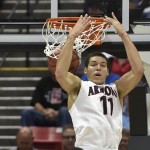 Arizona forward Aaron Gordon puts in a reverse dunk against Weber State during the first half in a second-round game in the NCAA college basketball tournament Friday, March 21, 2014, in San Diego. (AP Photo/Denis Poroy)