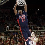 Arizona's Rondae Hollis-Jefferson (23) goes up for a shot next to Stanford guard Christian Sanders (1) during the first half of an NCAA college basketball game Thursday, Jan. 22, 2015, in Stanford, Calif. (AP Photo/Marcio Jose Sanchez)