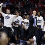 Xavier head coach Chris Mack, middle, and players on the Xavier bench react as the team plays Arizona during the second half of a college basketball regional semifinal in the NCAA Tournament, Thursday, March 26, 2015, in Los Angeles. (AP Photo/Jae C. Hong)