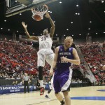 Arizona forward Rondae Hollis-Jefferson dunks a shot as Weber State center Kyle Tresnak turns away during the first half in a second-round game in the NCAA college basketball tournament Friday, March 21, 2014, in San Diego. (AP Photo/Gregory Bull)