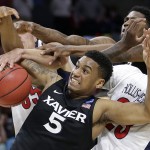 Xavier forward Trevon Bluiett (5) tries to hold on to the ball against Arizona during the second half of a college basketball regional semifinal in the NCAA Tournament, Thursday, March 26, 2015, in Los Angeles. (AP Photo/Jae C. Hong)