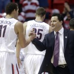 Arizona head coach Sean Miller, right, greets Arizona forward Aaron Gordon, left, as he leaves the game during the second half of a third-round game in the NCAA college basketball tournament Sunday, March 23, 2014, in San Diego. Arizona won, 84-61. (AP Photo/Lenny Ignelzi)