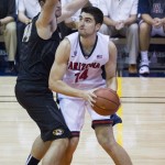 Arizona center Dusan Ristic (14) looks for an opening to shoot the basketball while being defended by Missouri forward Ryan Rosburg, left, in the second half of an NCAA college basketball game at the Maui Invitational on Monday, Nov. 24, 2014, in Lahaina, Hawaii. Arizona beat Missouri 72-53. (AP Photo/Eugene Tanner)