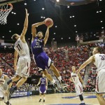 Weber State's Joel Bolomboy (21) tries ot shoot over Arizona forward Aaron Gordon during the second half in a second-round game in the NCAA college basketball tournament Friday, March 21, 2014, in San Diego. (AP Photo/Gregory Bull)