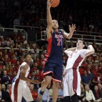 Arizona forward Brandon Ashley (21) shoots between Stanford forwards Rosco Allen (25) and Anthony Brown, left, during the first half of an NCAA college basketball game Thursday, Jan. 22, 2015, in Stanford, Calif. (AP Photo/Marcio Jose Sanchez)