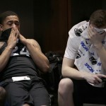 Xavier guard Andrew Mitchell, left, and teammate Tim Stainbrook react after losing 68-60 to Arizona in a college basketball regional semifinal in the NCAA Tournament, Thursday, March 26, 2015, in Los Angeles. (AP Photo/Jae C. Hong)