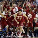 Wisconsin 's Bronson Koenig (24) reacts after making a three-point basket during the second half in a regional final NCAA college basketball tournament game against Arizona, Saturday, March 29, 2014, in Anaheim, Calif. (AP Photo/Jae C. Hong)