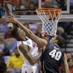 Arizona's Rondae Hollis-Jefferson dunks the ball over Colorado's Josh Scott during the second half of an NCAA college basketball game in the semifinals of the Pac-12 Conference on Friday, March 14, 2014, in Las Vegas. Arizona won 63-43. (AP Photo/Julie Jacobson)