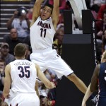 Arizona forward Aaron Gordon dunks a basket while playing Gonzaga during the first half of a third-round game in the NCAA college basketball tournament, Sunday, March 23, 2014, in San Diego. (AP Photo/Denis Poroy)
