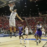 Arizona forward Aaron Gordon slams in a basket against Weber State during the first half in a second-round game in the NCAA college basketball tournament Friday, March 21, 2014, in San Diego. (AP Photo/Gregory Bull)