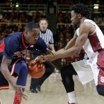 Arizona's Rondae Hollis-Jefferson, left, strips the ball from Stanford's Chasson Randle during the second half of an NCAA college basketball game Thursday, Jan. 22, 2015, in Stanford, Calif. Arizona won 89-82. (AP Photo/Marcio Jose Sanchez)