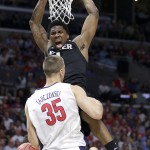 Xavier forward Jalen Reynolds reacts after dunking over Arizona center Kaleb Tarczewski (35) during the second half of a college basketball regional semifinal in the NCAA Tournament, Thursday, March 26, 2015, in Los Angeles. (AP Photo/Jae C. Hong)