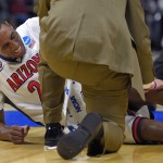 Arizona forward Rondae Hollis-Jefferson reacts after being injured during the first half of a college basketball regional semifinal against Xavier in the NCAA Tournament, Thursday, March 26, 2015, in Los Angeles. (AP Photo/Mark J. Terrill)