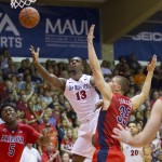 San Diego State forward Winston Shepard (13) puts up a shot as Arizona forward Stanley Johnson (5) and center Kaleb Tarczewski (35) look on in the first half of an NCAA college basketball game at the Maui Invitational on Wednesday, Nov. 26, 2014, in Lahaina, Hawaii. (AP Photo/Eugene Tanner)