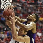 Weber State's Joel Bolomboy goes over Arizona's Aaron Gordon while battling for a rebound during the first half in a second-round game in the NCAA college basketball tournament Friday, March 21, 2014, in San Diego. (AP Photo/Denis Poroy)